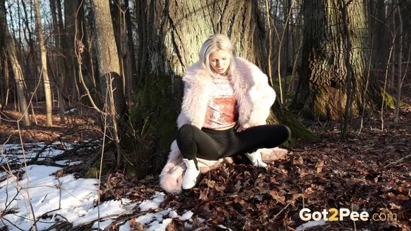 Hot blonde Vasya takes a piss in the woods against a tree in a winter coat  - Pissing, Pussy, Outdoor, Blonde, Spreading, Close Up, Shaved, Babe, Beautiful, Solo  - Photo 2