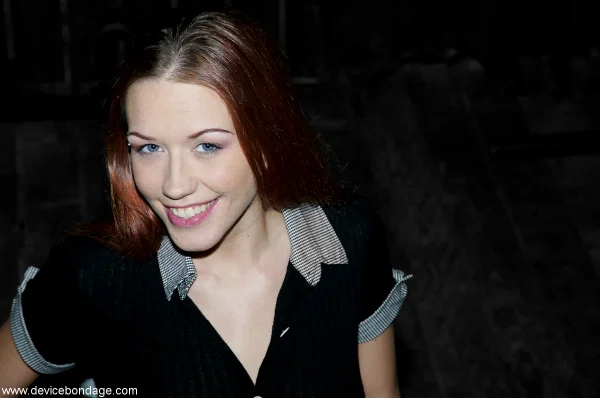 Device Bondage starring Smokie Flame Sex Pictures  - Bondage, Face, Redhead, Skirt, BDSM, Dress, Clothed, High Heels, Close Up, Legs  - Photo 13