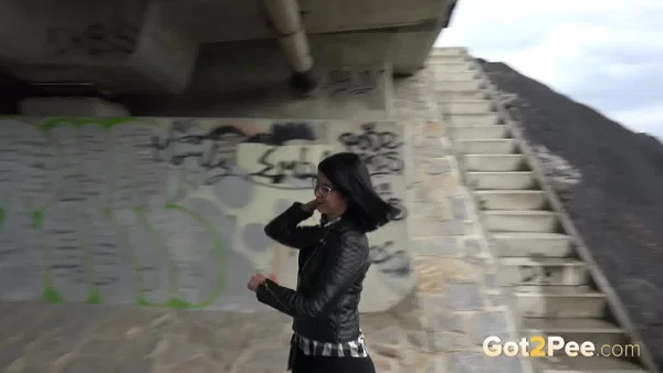 Dark haired girl Dee pulls down her leggings for a pee on concrete stairs  - Public, Pissing, Pussy, Glasses, Latina, Shaved, Leather, MILF, Spreading, Brunette  - Photo 14