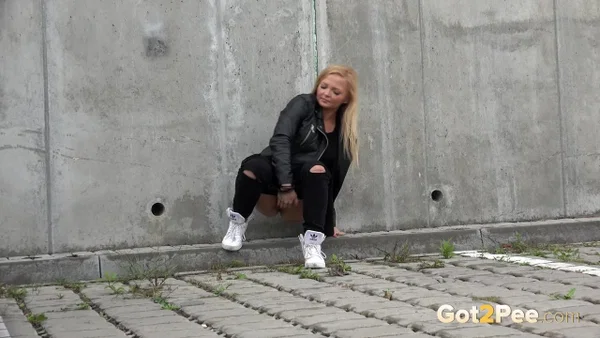 Blonde girl Jena Lovely pulls down black leggings for a pee near an overpass  - Pissing, Babe, Outdoor, Blonde, Leather, Clothed, Undressing, Beautiful, Solo  - Photo 3