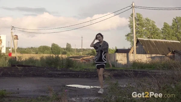 Leggy girl Kristina takes a piss behind a dilapidated building  - Pissing, Public, Outdoor, Skirt, Upskirt, Beautiful, Pussy, Solo, Shaved, Ass  - Photo 1