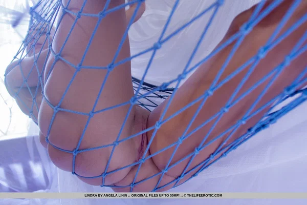 Gorgeous girl Lindra fingers her pussy while totally naked on a hammock  - Feet, Pussy, Shaved, Close Up, Legs, Tiny Tits, Ass, Spreading, Nipples, Masturbation  - Photo 3