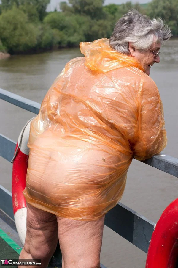 Obese oma Grandma Libby doffs a see-through raincoat to get naked on a bridge  - SSBBW, Granny, Saggy Tits, BBW, Chubby, Amateur, Curvy, Fetish, Thick, Glasses  - Photo 12