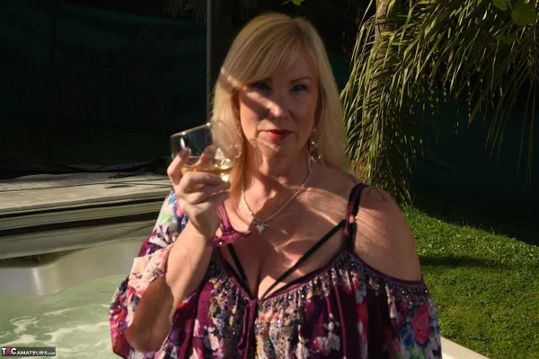 Fat older blonde Melody peels off black leggings afore an outdoor hot tub  - Mature, BBW, Curvy, Thick, Yoga Pants, Pool, Chubby, Amateur, Outdoor, Non Nude  - Photo 1