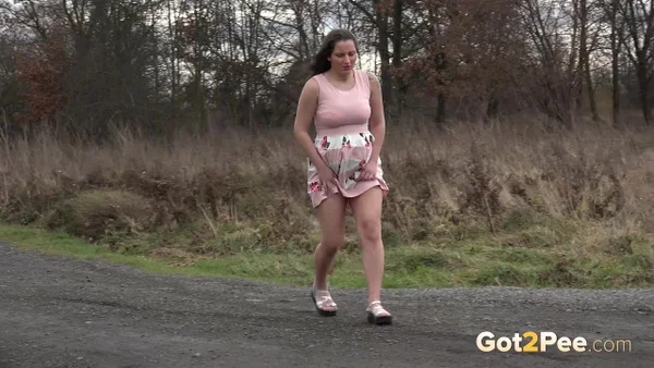 Caucasian girl Nicolette Noir takes a big piss on a dirt road in the country  - Pregnant, Pissing, Teen, Spreading, Outdoor, Czech, Non Nude, Close Up, Skirt, Tattoo  - Photo 2