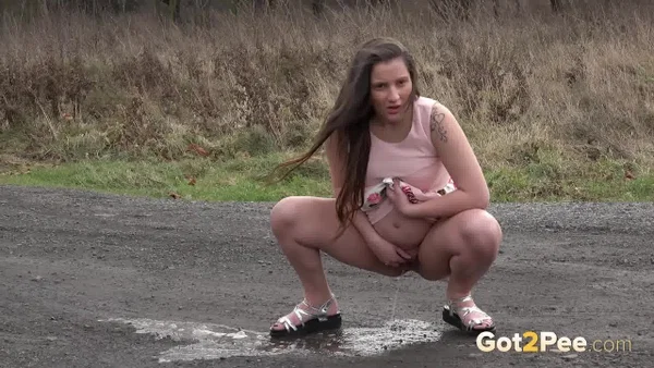 Caucasian girl Nicolette Noir takes a big piss on a dirt road in the country  - Pregnant, Pissing, Teen, Spreading, Outdoor, Czech, Non Nude, Close Up, Skirt, Tattoo  - Photo 12