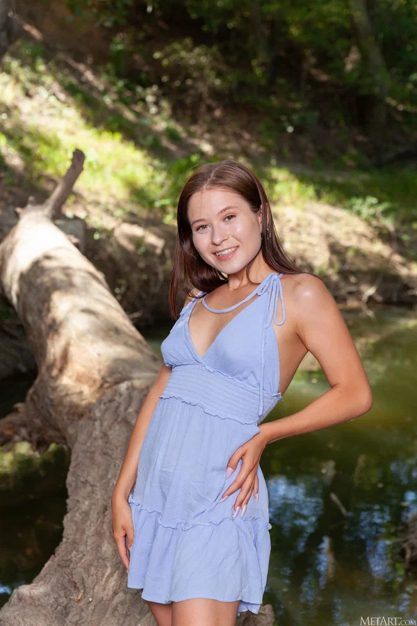 Young looking girl gets totally naked on a fallen log in the woods  - Teen, Cute, Babe, Beautiful, Solo, Glamour, Model, Brunette  - Photo 1
