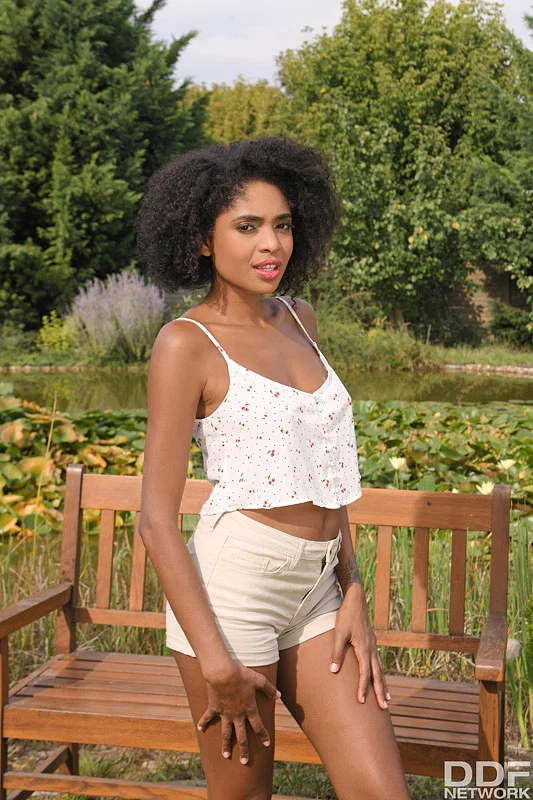 Black girl Luna Corazon spreads her pussy after getting naked on garden bench  - Brazilian, Ebony, Outdoor, Shorts, African, Big Tits, Spreading, Babe, Brunette, Pussy  - Photo 1