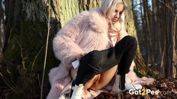 Hot blonde Vasya takes a piss in the woods against a tree in a winter coat  - Pissing, Pussy, Outdoor, Blonde, Spreading, Close Up, Shaved, Babe, Beautiful, Solo  - Photo 13