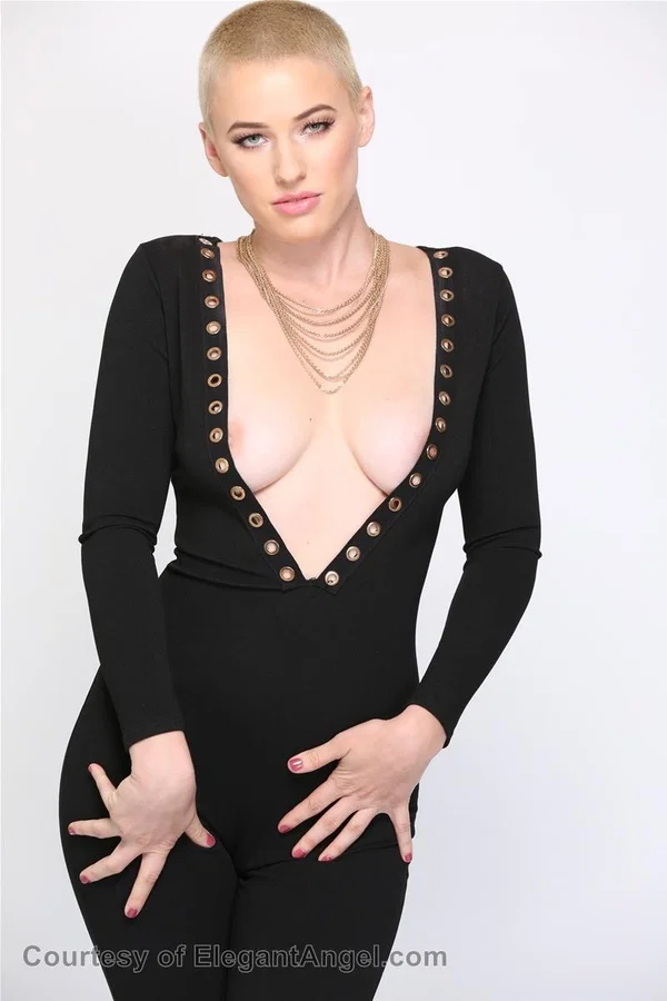Blonde Riley Nixon poses in her tight black outfit & unveils her big tits  - Short Hair, Teen, Canadian, White, Natural Tits, Clothed, Pornstar, Big Tits, Beautiful, Blonde  - Photo 14