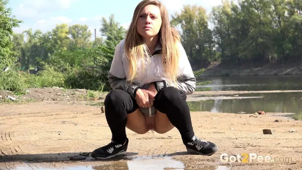 Blonde chick Barbe pulls down black leggings for a pee on a country road  - Pissing, Outdoor, Babe, Clothed, Beautiful, Ass, Undressing, PAWG, Solo  - Photo 8