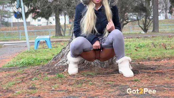 Blonde girl Victoria Pure pulls down her leggings to pee against a public tree  - Pissing, Public, Beautiful, Czech, Outdoor, Blonde, Close Up, Pussy, Shaved, Babe  - Photo 6