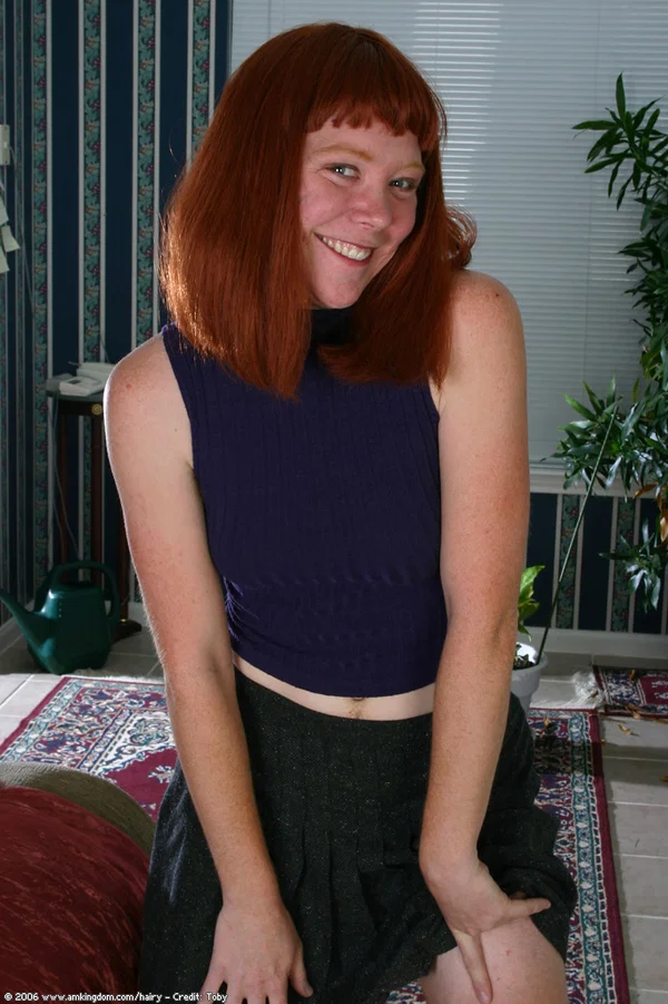 Redheaded amateur sports bushy pits and pubic hairs while getting naked  - Hairy, Redhead, Amateur, Pussy, Beautiful, Solo, Big Clit, Babe, Skirt, Tiny Tits  - Photo 1