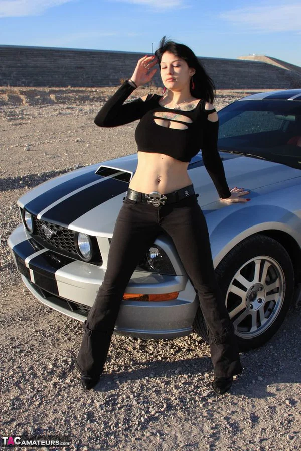 Brunette amateur Susy Rocks models by a muscle car during a safe for work gig  - Outdoor, Tall, Ass, Amateur, PAWG, Beautiful, Solo, Brunette, Non Nude  - Photo 2