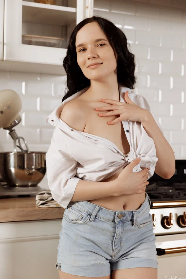 Dark haired girl gets completely naked before displaying her spread pussy  - Hairy, Babe, Brunette, Beautiful, Pussy, Shorts, Solo, Kitchen, Clothed, Tiny Tits  - Photo 2