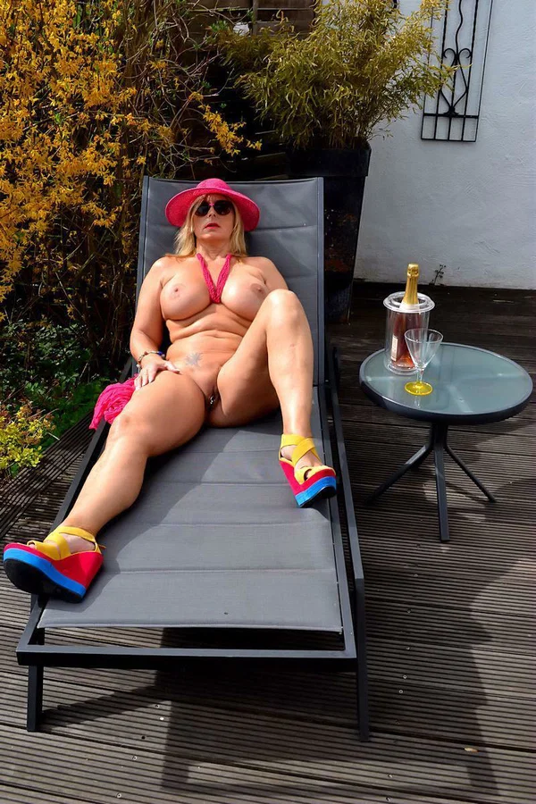 Mature blonde Nude Chrissy gets naked on a lounge chair in a sun hat and shades  - Mature, Dutch, Chubby, MILF, Thick, Curvy, BBW, Outdoor, Glasses, Tattoo  - Photo 2