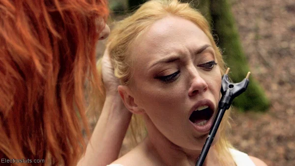 Redhead Dominatrix subjects blonde girl Dee Williams to cattle prod in woods  - Bondage, MILF, BDSM, Outdoor, Blonde, Non Nude  - Photo 8