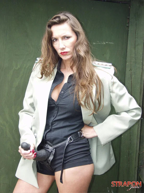 British lady Strapon Jane poses with her hair in a messy bun in long boots  - Mature, Strapon, Big Tits, Outdoor, Boots, Shorts, Clothed, Non Nude, High Heels, Uniform  - Photo 3