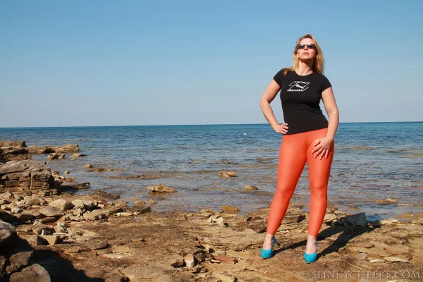 Hot MILF Desyra Noir reveals her big tits as she strips to her latex leggings  - German, Yoga Pants, Beach, MILF, Outdoor, Glasses, Ass, White, Big Tits, High Heels  - Photo 1