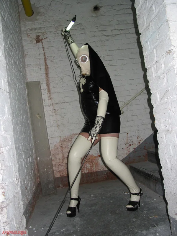 Solo model Avengelique sports a gas mask while wearing latex Nun clothing  - Nun, Latex, Skirt, Fetish, Uniform, Stockings, Clothed, High Heels, PAWG, Legs  - Photo 16