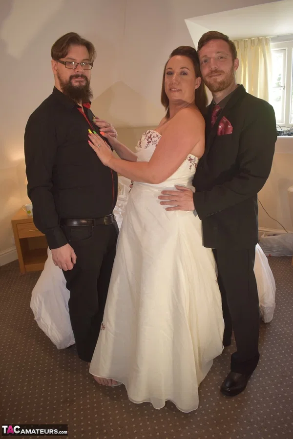 Amateur woman Sara Banks as her tits and pussy freed from a gown by two men  - Wedding, Reality, Curvy, Mature, Chubby, BBW, Thick, Threesome, Clothed, Upskirt  - Photo 2