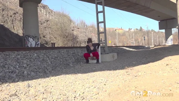 Brunette chick Olivia takes a piss beside railroad tracks under a bridge  - Pissing, Public, Outdoor, Close Up, Ass, PAWG, Babe, Beautiful, Solo, Brunette  - Photo 3