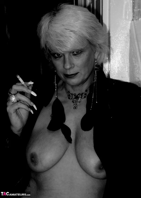 Older blonde lights a cigarette while showing her bare breasts and pussy  - Smoking, Mature, Saggy Tits, Short Hair, Amateur, Big Tits, Stockings, Hairy, Close Up, Spreading  - Photo 15