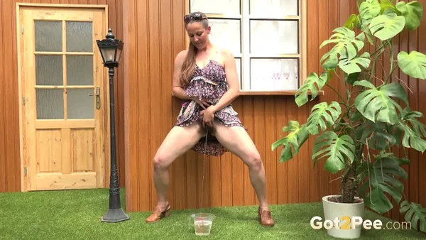 Blonde woman Nicol D hikes short dress to pee standing behind the house  - Public, Pissing, Hairy, Spreading, Legs, Babe, Upskirt, Close Up, Skirt, Clothed  - Photo 10