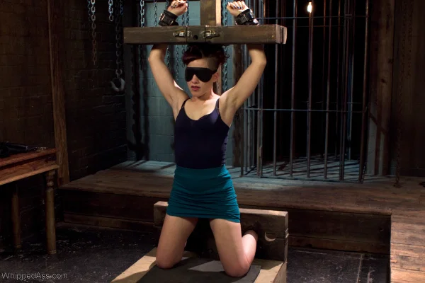 White female is forced to suck a sex toy while restrained in a dungeon  - Femdom, BDSM, Bondage, Redhead, Lesbian, Blonde, White  - Photo 1