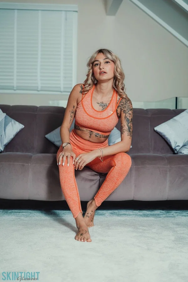 Tattooed blonde Seline P Seline P removes skintight athletic wear to get naked  - Yoga Pants, Tattoo, Model, Big Tits, Clothed, Undressing, Legs, Blonde, Glamour, Spreading  - Photo 1