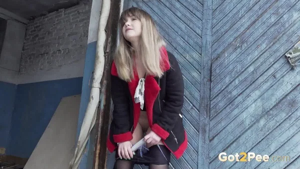 Blonde girl Veronica takes a pee in nylons up against a wooden door  - Pissing, Public, Pantyhose, Outdoor, Close Up, Pussy, Panties, Shaved, Skirt, Blonde  - Photo 12