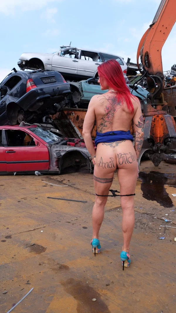 Redhead MILF with tattoos and fake tits gets banged in a junk yard 3some  - German, Blowbang, Gangbang, Tattoo, Ass, Groupsex, Upskirt, PAWG, Redhead, Cumshot  - Photo 5