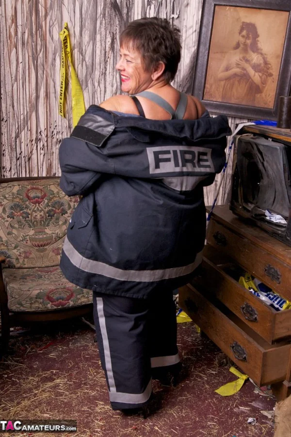 Mature fatty doffs her firefighter clothing to show her twat in stockings  - Mature, BBW, Amateur, Stockings, Brunette, Short Hair, Chubby, Uniform, European, Clothed  - Photo 12
