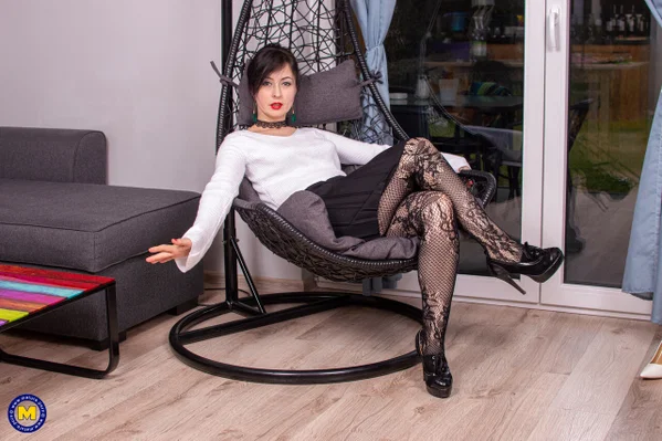 Middle-aged brunette masturbates with a sex toy in mesh stockings  - Mature, Stockings, Amateur, Pussy, Dildo, Saggy Tits, Ass, Masturbation, High Heels, Lingerie  - Photo 1