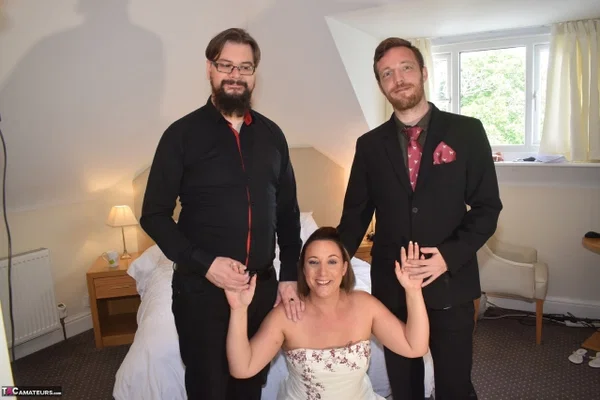 Amateur woman Sara Banks as her tits and pussy freed from a gown by two men  - Wedding, Reality, Curvy, Mature, Chubby, BBW, Thick, Threesome, Clothed, Upskirt  - Photo 3
