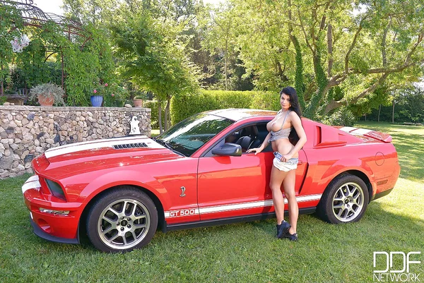 Busty brunette babe Lucy Li posing topless outdoors next to sports car  - Outdoor, Babe, Big Tits, European, Teen, Brunette, Natural Tits, Shorts, Beautiful, Ass  - Photo 4