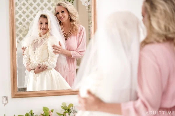 Carolina Sweets is affixed with a garter before a lesbian wedding to Julia Ann  - Wedding, Reality, Mature, Upskirt, Non Nude, MILF, Lesbian, Blonde, Skirt, Skinny  - Photo 13