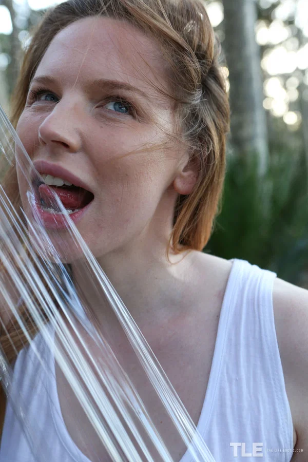 Pale redhead Madison Missina restrained yourself to a tree with plastic wrap  - Pale, Fetish, Outdoor, Teen, Big Tits, Close Up, Shorts, Cute, Spreading, Babe  - Photo 3