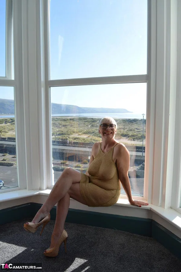Big titted older woman Barby Slut showcases her bald twat in front of a window  - Mature, Glasses, BBW, Skirt, Thick, Chubby, Curvy, Short Hair, Legs, Spreading  - Photo 5