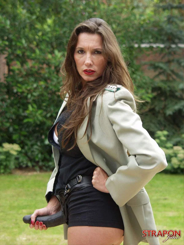 British lady Strapon Jane poses with her hair in a messy bun in long boots  - Mature, Strapon, Big Tits, Outdoor, Boots, Shorts, Clothed, Non Nude, High Heels, Uniform  - Photo 13