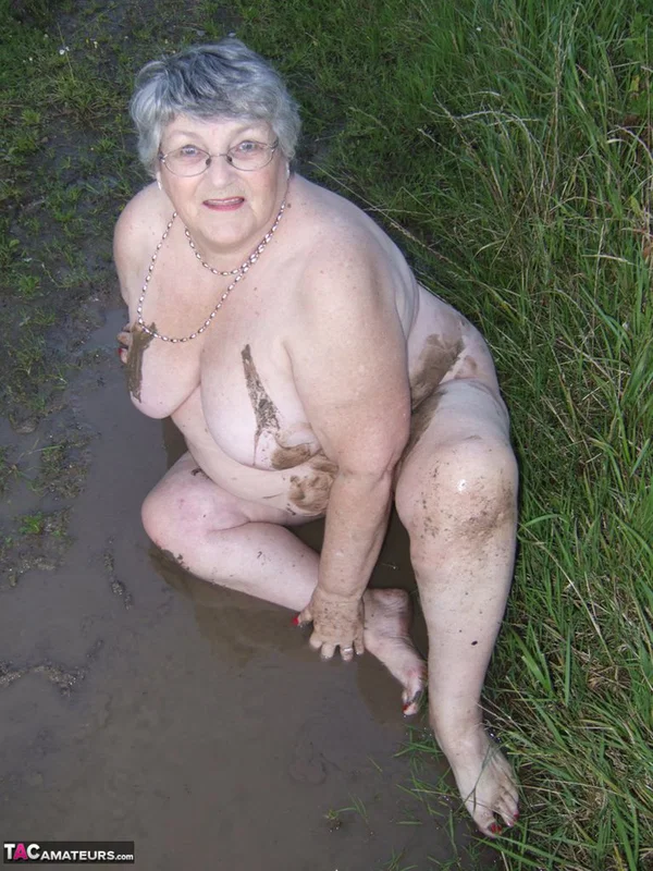 Fat nan Grandma Libby steps into a puddle before covering herself in mud  - Granny, BBW, Saggy Tits, Outdoor, Amateur, Chubby, Wet, Glasses, Curvy, Thick  - Photo 14