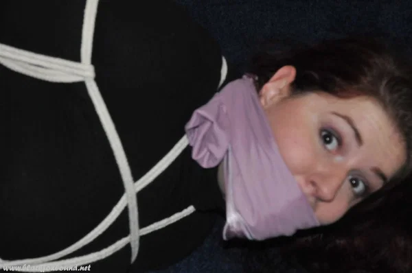 Helpless female struggles against her restraints while hogtied and silenced  - Non Nude, Bondage, Clothed, Stockings, Skirt, High Heels, BDSM  - Photo 9