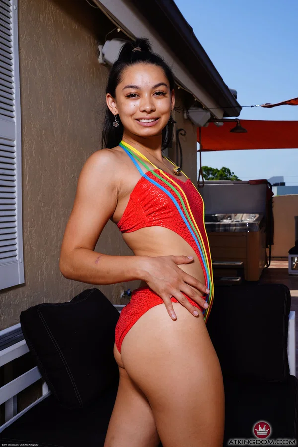 Asian teen Iris Ivy removes red swimwear while going nude on a patio  - Asian, Cute, Amateur, Teen  - Photo 1