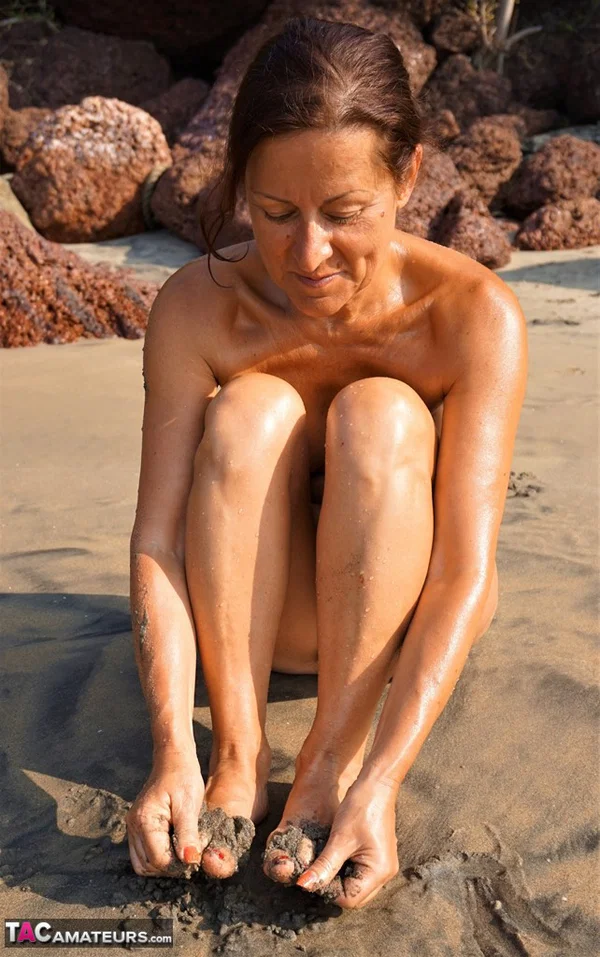 Naked older woman Diana Ananta covers her feet in beach sand at low tide  - Beach, Cougar, Mature, Amateur, Outdoor, Saggy Tits, Feet, Spreading, Pussy, Brunette  - Photo 6