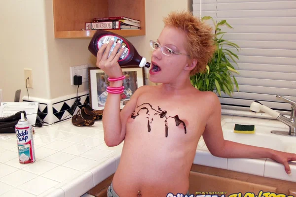 Naughty redhead Emily Davinci goes topless & indulges in a food play solo  - Short Hair, Glasses, Redhead, Beautiful, Skirt, Teen, Clothed, Kitchen, Tiny Tits, Ass  - Photo 17