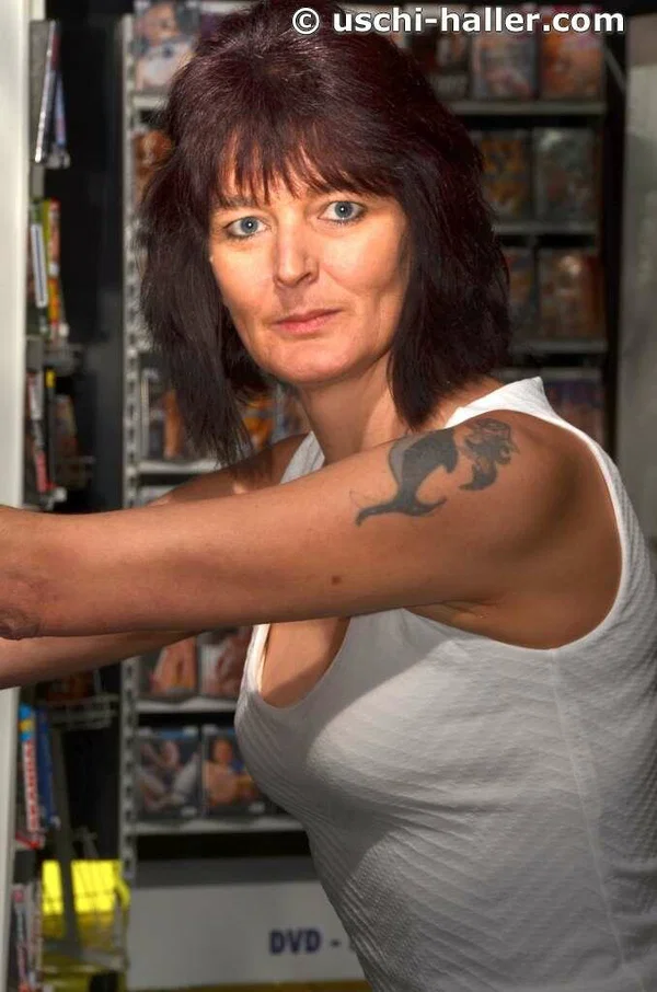 Older housewife Biggi Bitch goes topless in nylons at an adult video store  - Wife, Short Hair, Boots, MILF, Lingerie, Amateur, Brunette, Tattoo, Stockings, Upskirt  - Photo 3