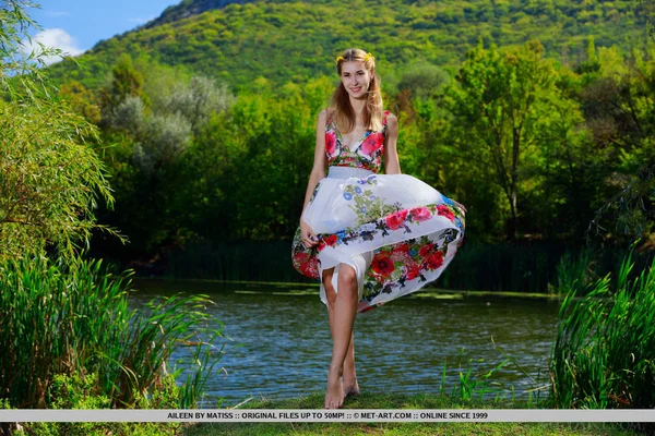 Skinny teen Aileen removes her dress to pose nude near a river  - Skinny, Outdoor, Undressing, Tiny Tits, Cute, Face, Ass, Legs, Close Up, Shaved  - Photo 1