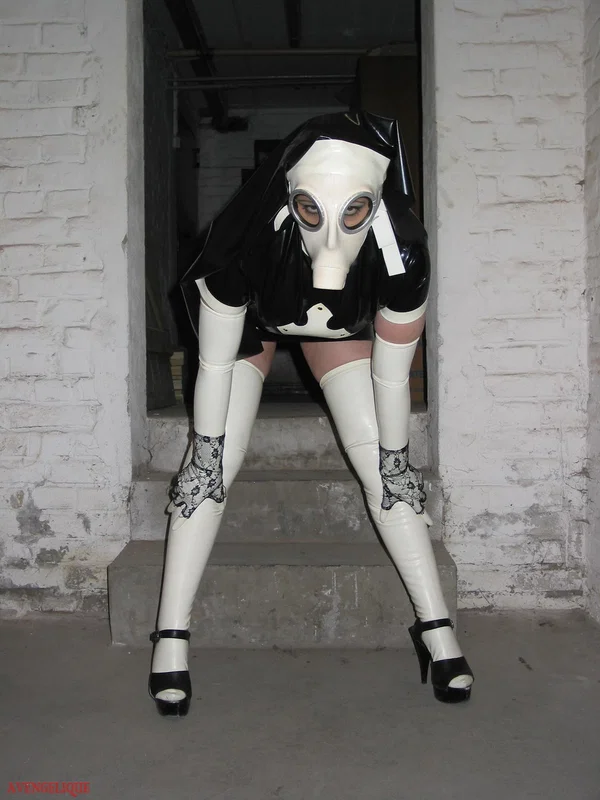 Solo model Avengelique sports a gas mask while wearing latex Nun clothing  - Nun, Latex, Skirt, Fetish, Uniform, Stockings, Clothed, High Heels, PAWG, Legs  - Photo 4
