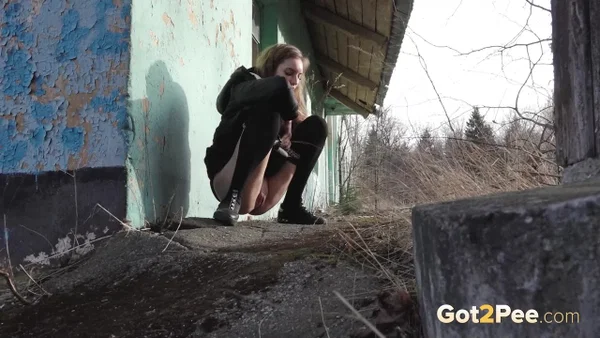 Solo girl pulls down black hose before squatting to pee beside a building  - Public, Pissing, Pantyhose, Non Nude, Pussy, Shaved, Babe, Outdoor, European, Close Up  - Photo 5