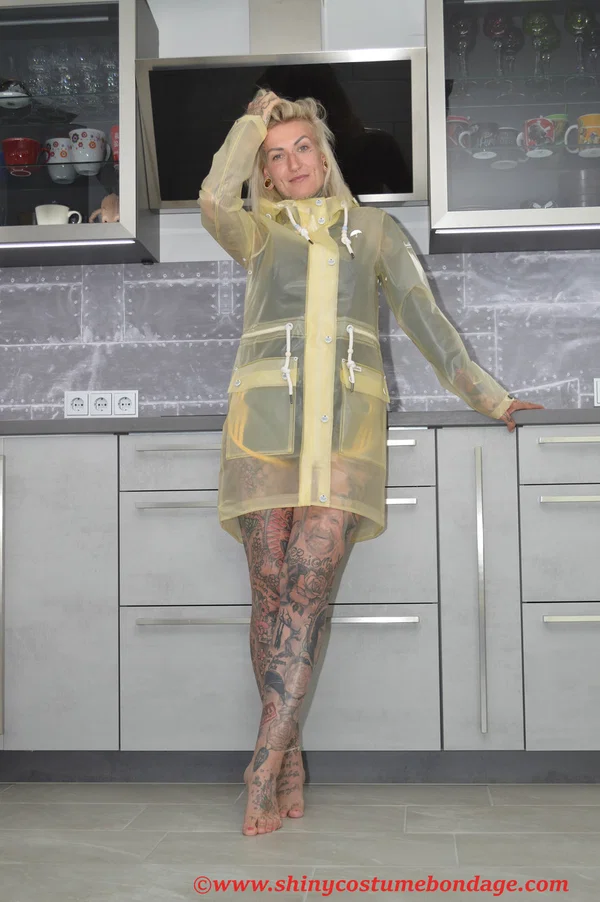 Tattooed blonde Miss Francine models barefoot in a raincoat over rubber wear  - Tattoo, Latex, Skirt, Fetish, Clothed, Kitchen, Shorts, Blonde, Non Nude  - Photo 6